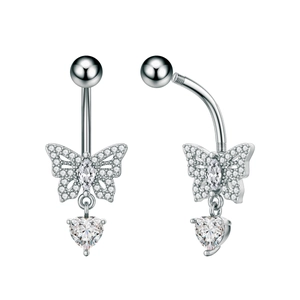 Macro view of butterfly navel piercing with heart zircon and polished silver finish