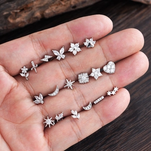 Minimalist silver stud earrings with zirconia stones in various geometric shapes