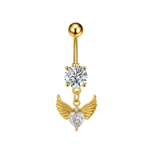 Detail of gold navel ring featuring round zircon and heart pendant with angel wings
