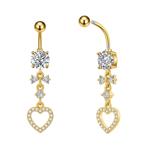 Macro view of gold butterfly belly ring with sparkling zircon and heart pendant detail
