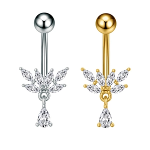 Detail of silver and gold belly rings with marquise and pear shaped cubic zirconia