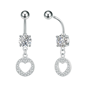 Macro detail of silver stainless steel heart belly ring with clear cubic zirconia stones