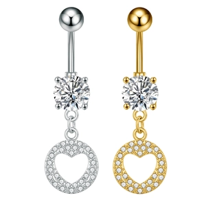 Macro shot of silver and gold heart navel rings with micro-pave cubic zirconia crystals