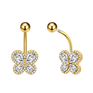Macro detail of golden butterfly belly ring with sparkling zircon wings and screw thread