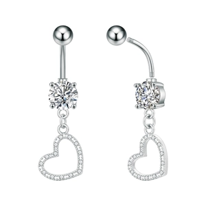 Macro detail of silver stainless steel heart belly ring with cubic zirconia stones
