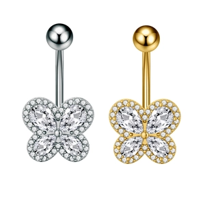 Close-up of gold and silver butterfly navel rings with cubic zirconia inlay details