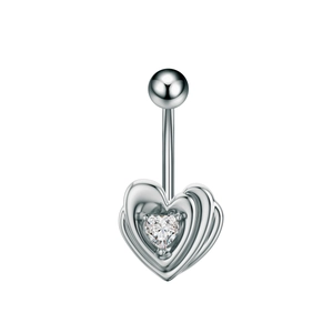 Macro detail of silver heart belly button ring with sparkling heart-shaped zircon stone