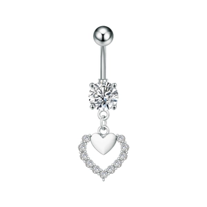 Detailed close-up of a silver navel ring with sparkling heart-shaped zircon pendant