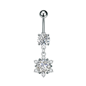 Macro shot of silver snowflake navel ring with sparkling cubic zirconia stones