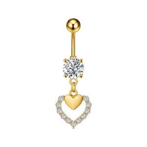 Macro detail of gold belly button ring with heart pendant and sparkling zircon stones