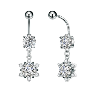 Detailed macro view of silver snowflake belly button rings with sparkling cubic zirconia