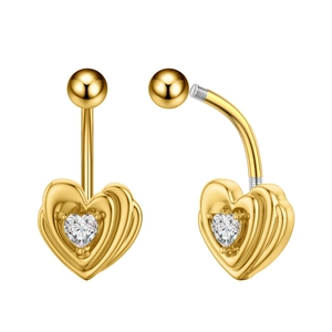 Close-up of golden heart belly ring with heart-shaped zircon and screw thread detail
