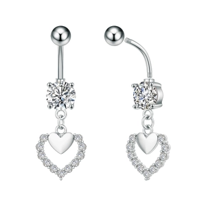 Detail view of heart-shaped belly button ring with zircon stones and silver metal