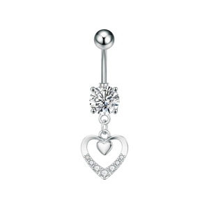 Detailed macro view of heart-shaped belly button ring with silver cubic zirconia stones
