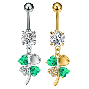 Detailed macro of butterfly clover belly ring with green zircon and pavé stones