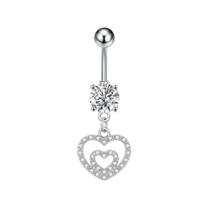 Macro shot of stainless steel belly button ring featuring a double heart pendant with zircons