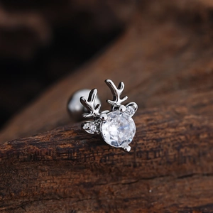 Macro shot of silver reindeer earring with cubic zirconia and screw ball backing