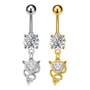 Detail of heart-shaped devil belly rings with shiny zircon in gold and silver plating