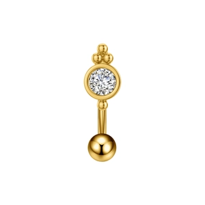 Dettaglio di piercing all'ombelico dorato con zircone tondo e piccole perline