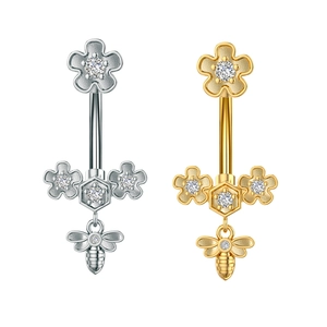 Detailed close-up of bee and flower belly rings with sparkling zircon in gold and silver