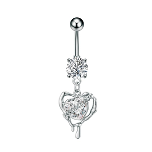 Detail of silver navel piercing with sparkling zircon heart pendant and lava metal frame