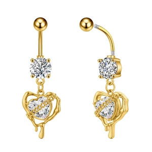 Detail of butterfly navel ring featuring fluid gold heart frame and heart-cut zircon stone