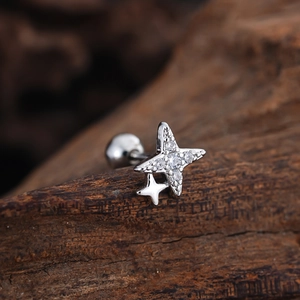Macro shot of double star earring stud with zircon inlay and screw ball back closure