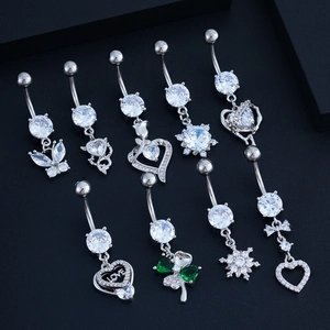 Nine silver navel rings with butterfly and heart zircon pendants on black background