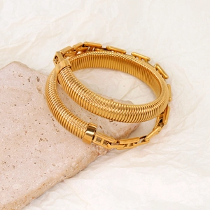 Detailed macro view of 18K gold plated snake chain bracelet with classic metal H-links