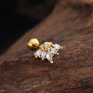 Macro detail of gold helix stud featuring marquise-cut zircons and ball-back closure