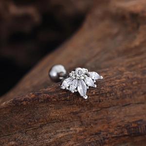Macro shot of silver stainless steel tragus stud with marquise cubic zirconia inlay