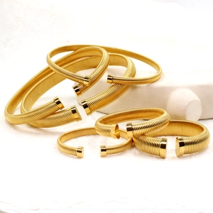 Elegant gold spiral spring open cuff bracelets in thick and thin minimalist metal styles