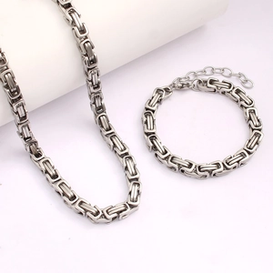 Detailed view of silver Byzantine chain necklace and bracelet set with lobster clasp