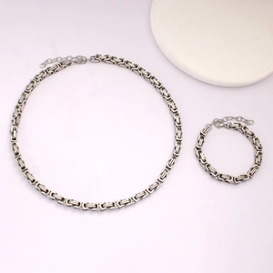 Detailed view of silver Byzantine square link chain necklace and bracelet set