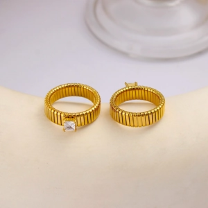 Detail of 18K gold plated square zircon ring with unique tubogas style wave texture