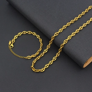 Detail of 18K gold-plated pig-nose link chain set including necklace and bracelet