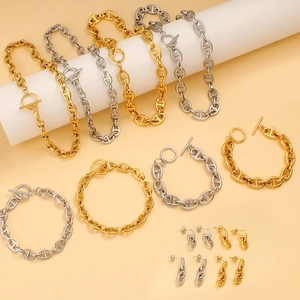 Detail of gold and silver coffee bean link jewelry sets with elegant toggle clasps