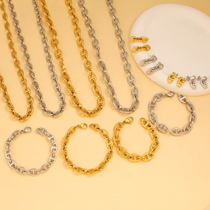 Detailed set of 18K gold and silver pig nose anchor link chain necklace and bracelet