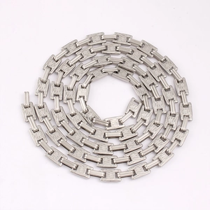 Detailed macro view of silver stainless steel H-link chain with textured surface