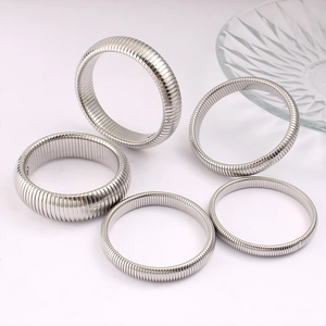 Polished silver stainless steel stretch gaspipe bracelets set with ribbed texture