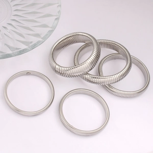 Set of five silver elastic tubogas stretch bracelets with textured stainless steel finish