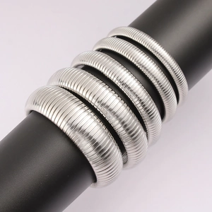Minimalist silver stainless steel Tubogas elastic stretch bracelets in a stacked set