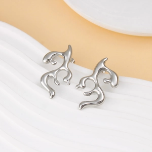 Detailed view of silver liquid metal irregular geometric earrings on a white display