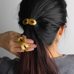 Polished 18K gold plated infinity shape elastic hair tie for elegant ponytails