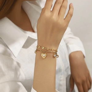 Bracelet double couche élégant plaqué or 18 carats avec pendentifs cœur et soleil pour femme