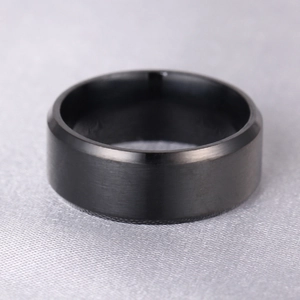 Macro view of a 316L titanium steel ring with black matte finish and beveled edges