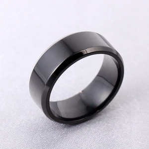 Macro detail of 8mm black beveled edge titanium steel ring with polished finish
