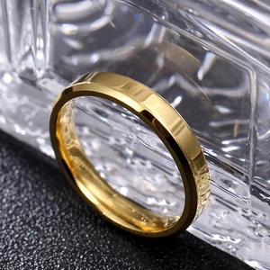 Macro shot of 8mm gold polished titanium steel ring with double beveled edges design