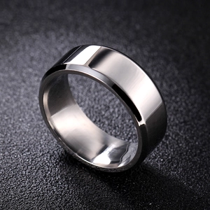 Macro shot of 8mm silver steel ring with beveled edges and polished mirror surface