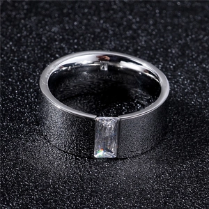 Close-up of 8mm tungsten steel ring with matte texture and rectangular zircon inlay